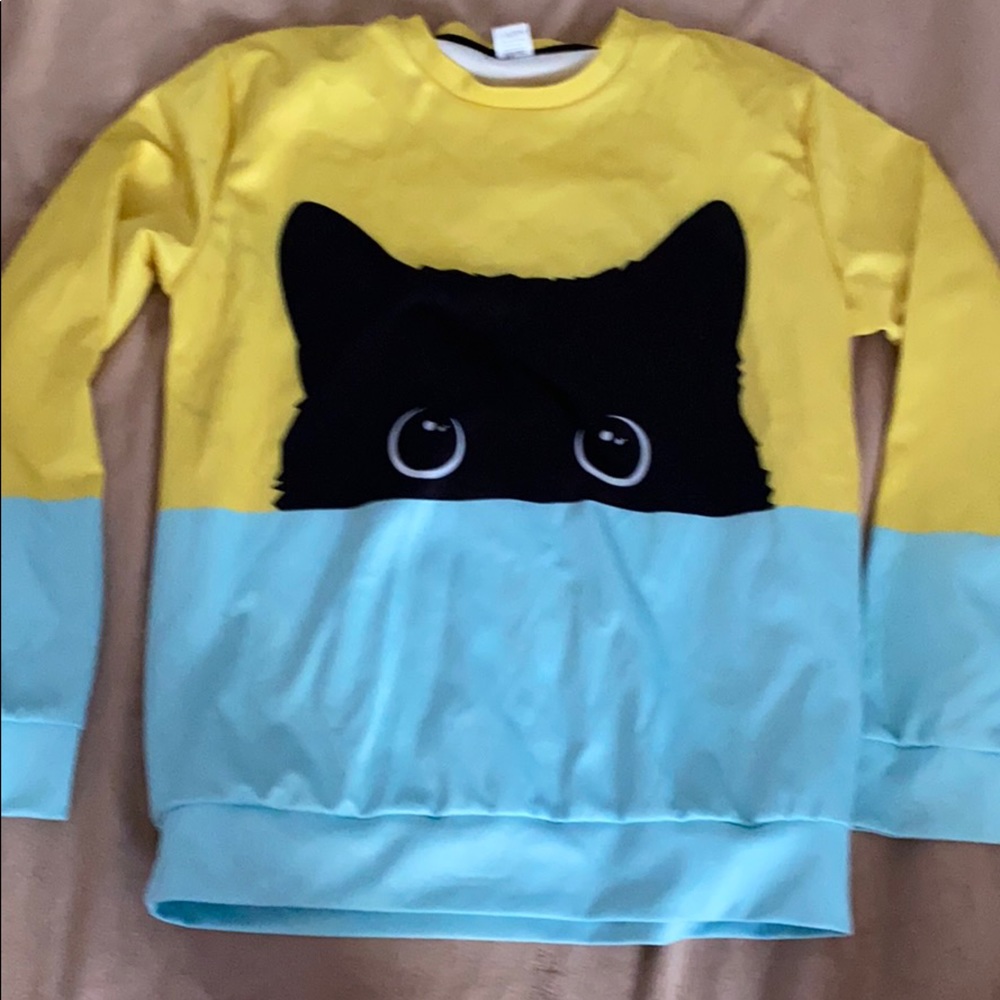 Brightly colored pullover w black cat print